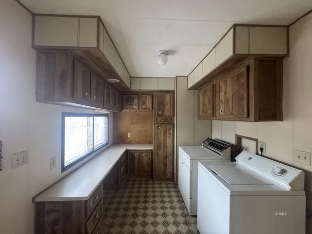 a view of a yard with plants and trees