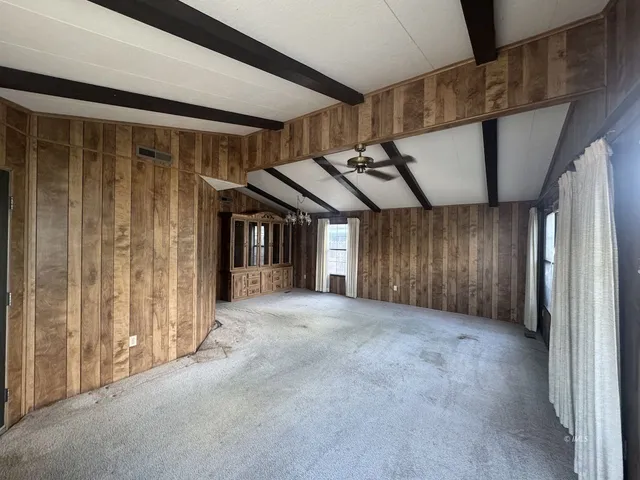 a view of a hallway with windows