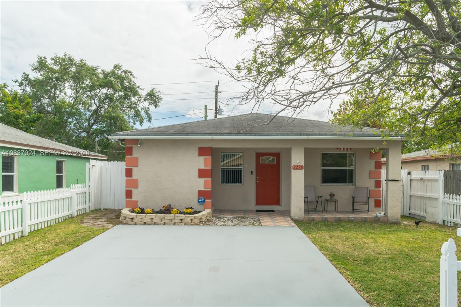 2220 Raleigh Street Hollywood, FL 33020 - Photo 1 of 23 a front view of house with yard