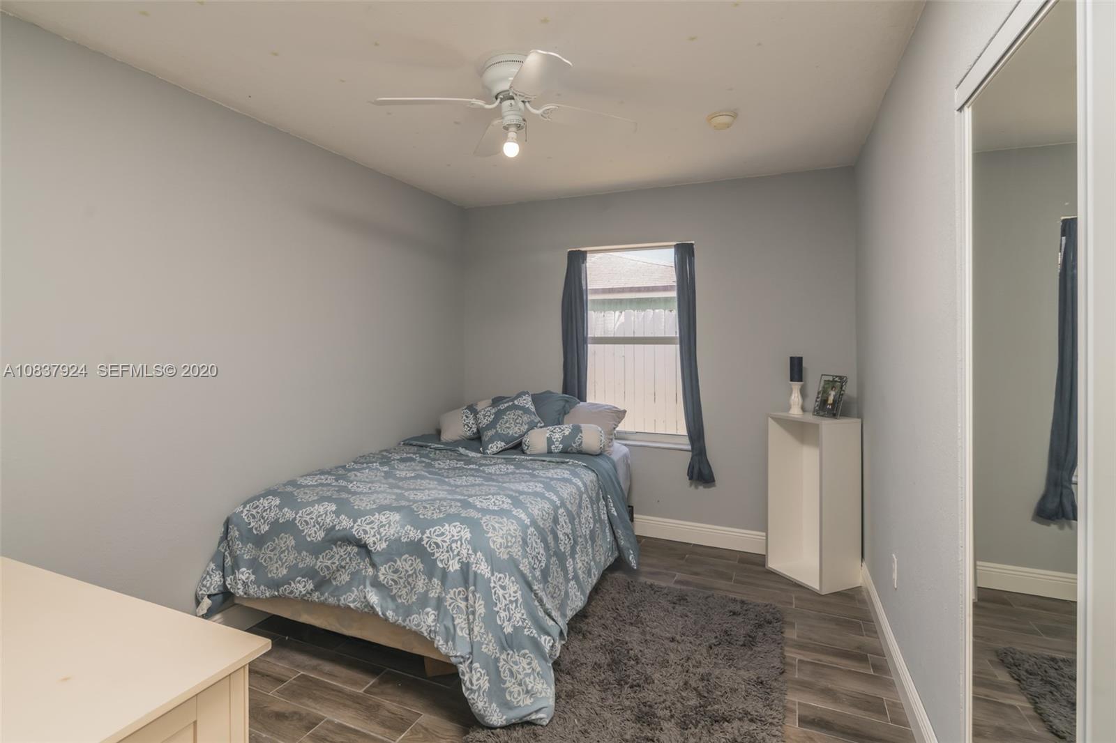 2220 Raleigh Street Hollywood, FL 33020 - Photo 17 of 23 a bedroom with a bed and a window