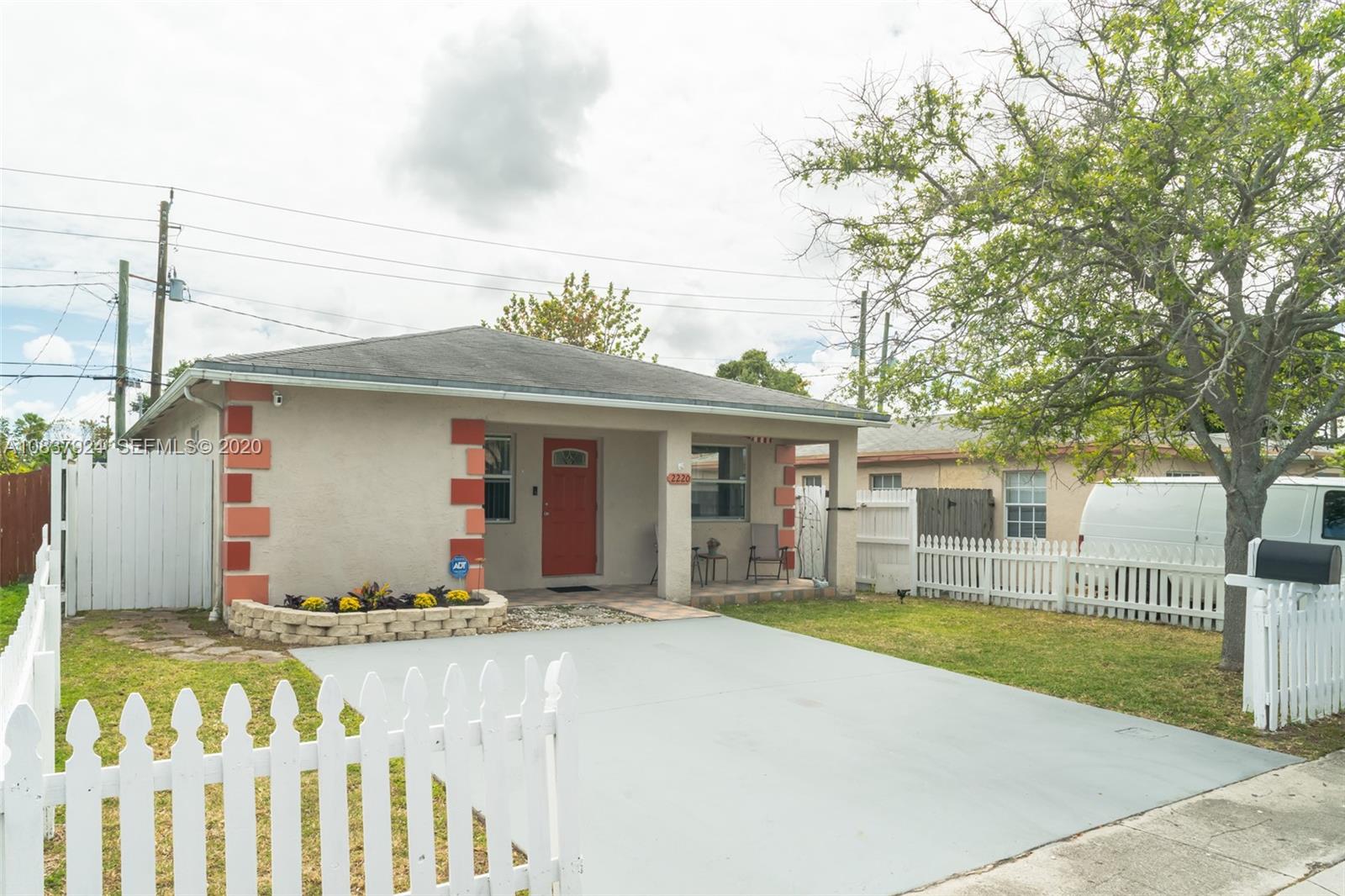 2220 Raleigh Street Hollywood, FL 33020 - Photo 2 of 23 a front view of house with yard outdoor seating and barbeque oven