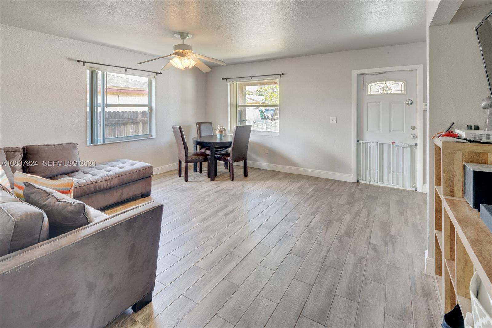 2220 Raleigh Street Hollywood, FL 33020 - Photo 3 of 23 a living room with furniture and a flat screen tv