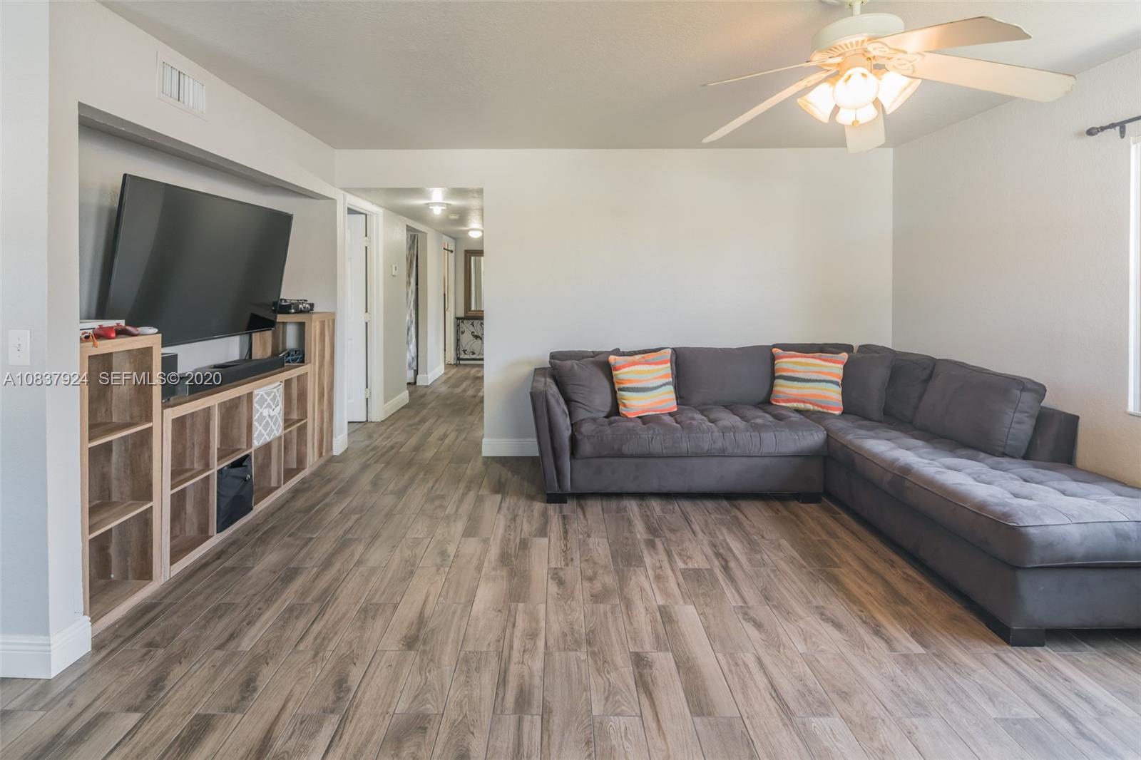 2220 Raleigh Street Hollywood, FL 33020 - Photo 5 of 23 a living room with furniture and a flat screen tv