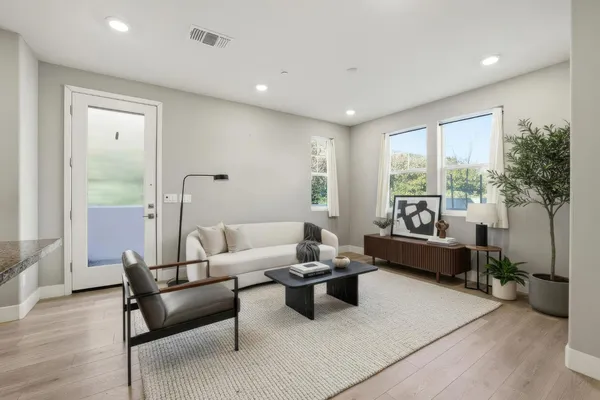 a living room with furniture and a large window