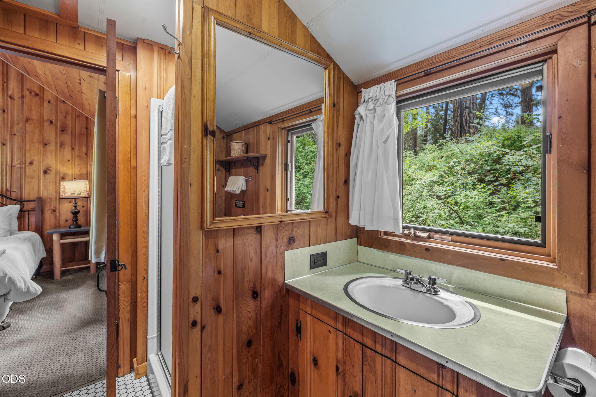 13375 Southwest Forest Service Road, Unit 3 U1 Camp Sherman, OR 97730 - Photo 17 of 29 a bathroom with a sink and a mirror