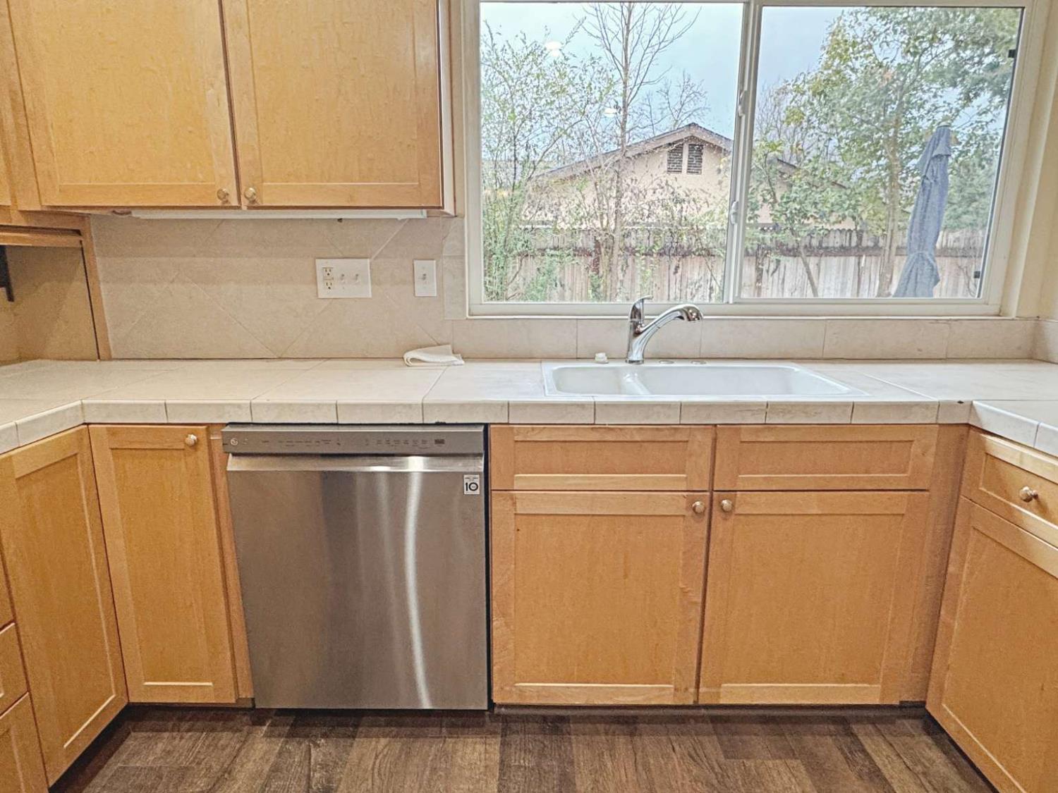 6249 Sunmist Way Citrus Heights, CA 95621 - Photo 11 of 24 a kitchen with a sink and cabinets