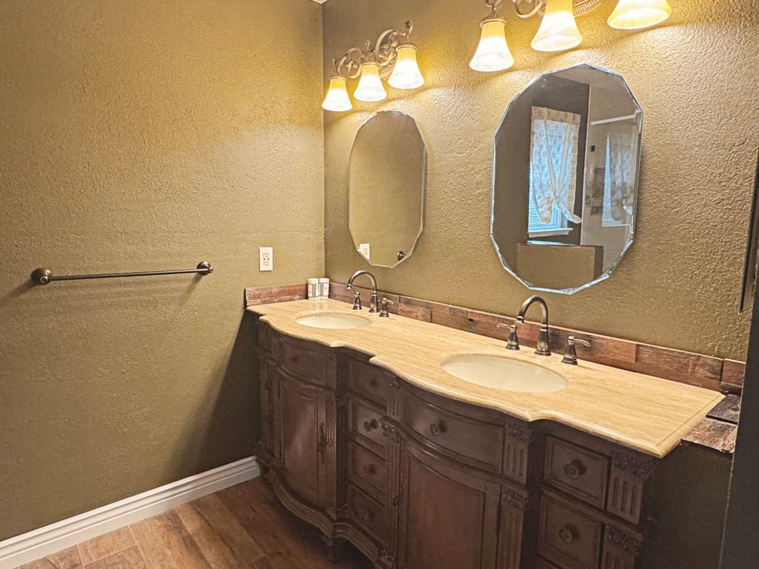 6249 Sunmist Way Citrus Heights, CA 95621 - Photo 14 of 24 a bathroom with a double vanity sink and a mirror