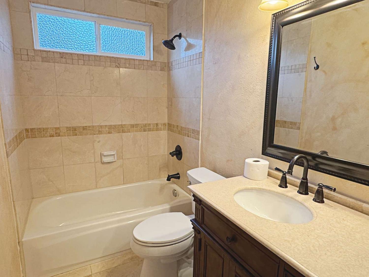 6249 Sunmist Way Citrus Heights, CA 95621 - Photo 15 of 24 a bathroom with a granite countertop sink toilet and shower