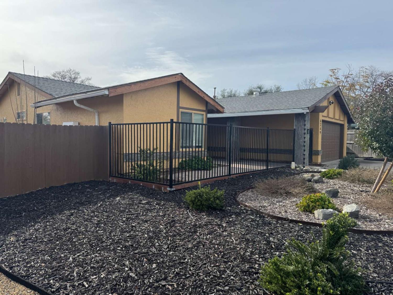 6249 Sunmist Way Citrus Heights, CA 95621 - Photo 2 of 24 a view of a house with a small yard and a large tree