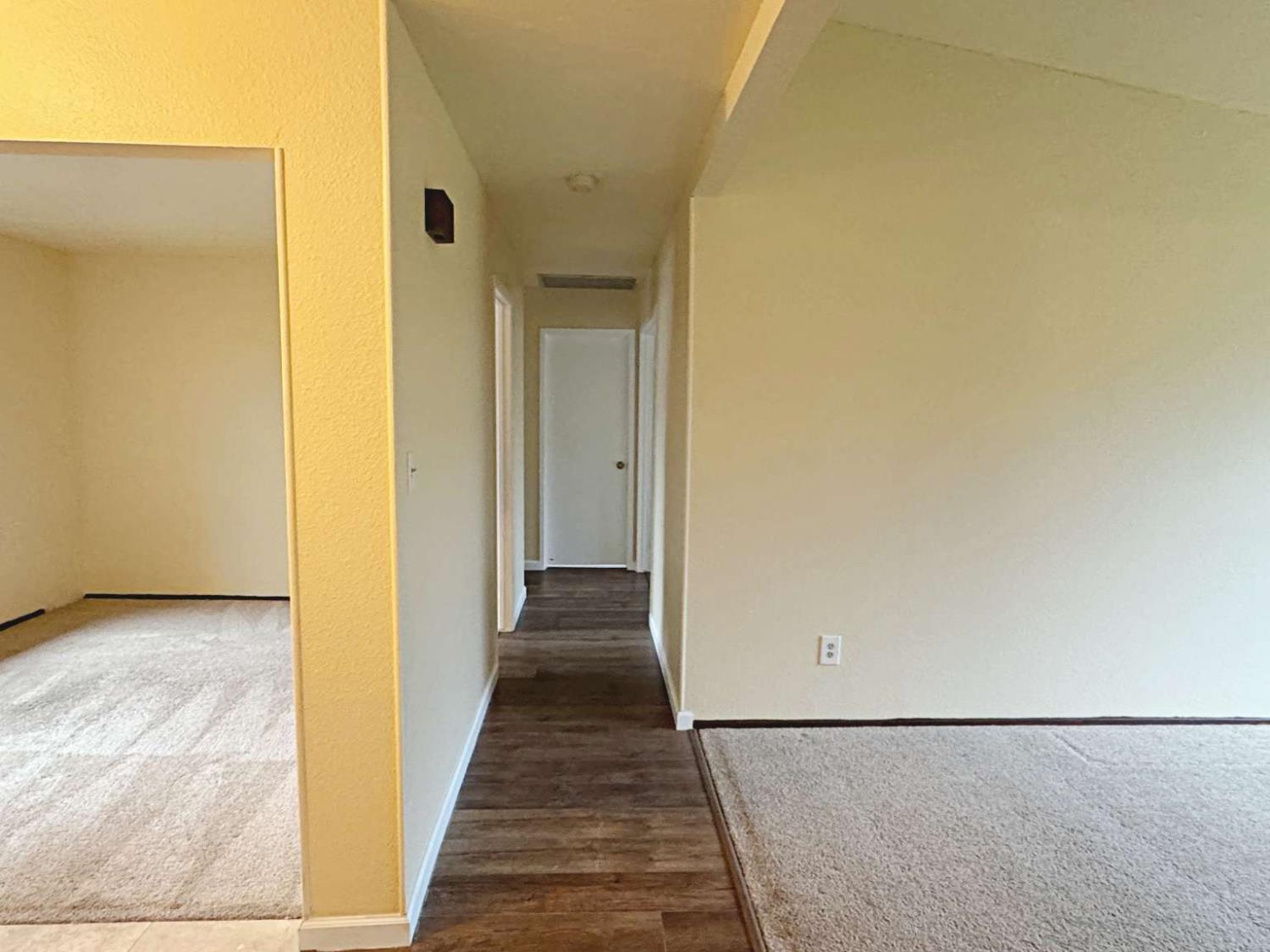 6249 Sunmist Way Citrus Heights, CA 95621 - Photo 21 of 24 a view of a hallway with wooden floor