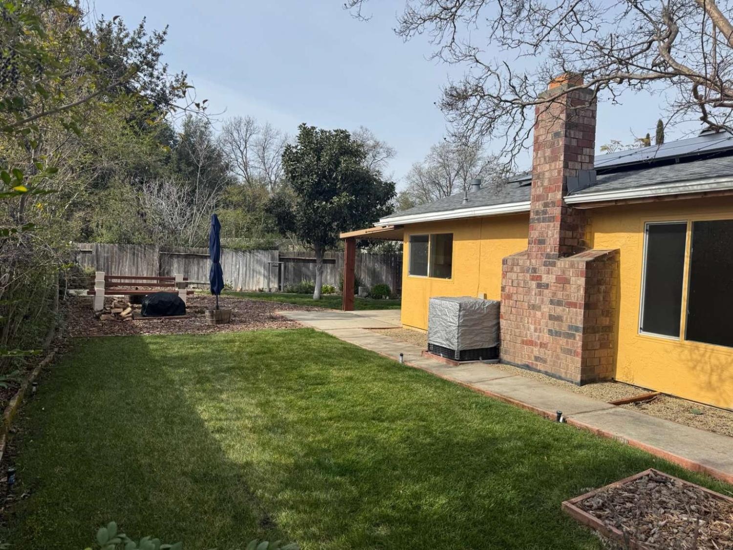 6249 Sunmist Way Citrus Heights, CA 95621 - Photo 4 of 24 a front view of a house with a garden and plants