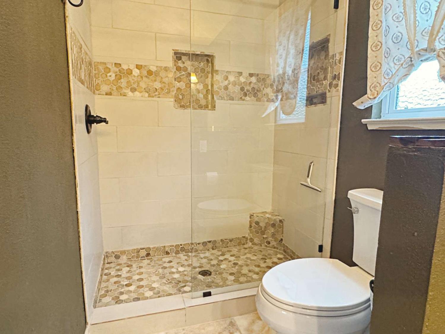 6249 Sunmist Way Citrus Heights, CA 95621 - Photo 9 of 24 a white toilet sitting next to a shower