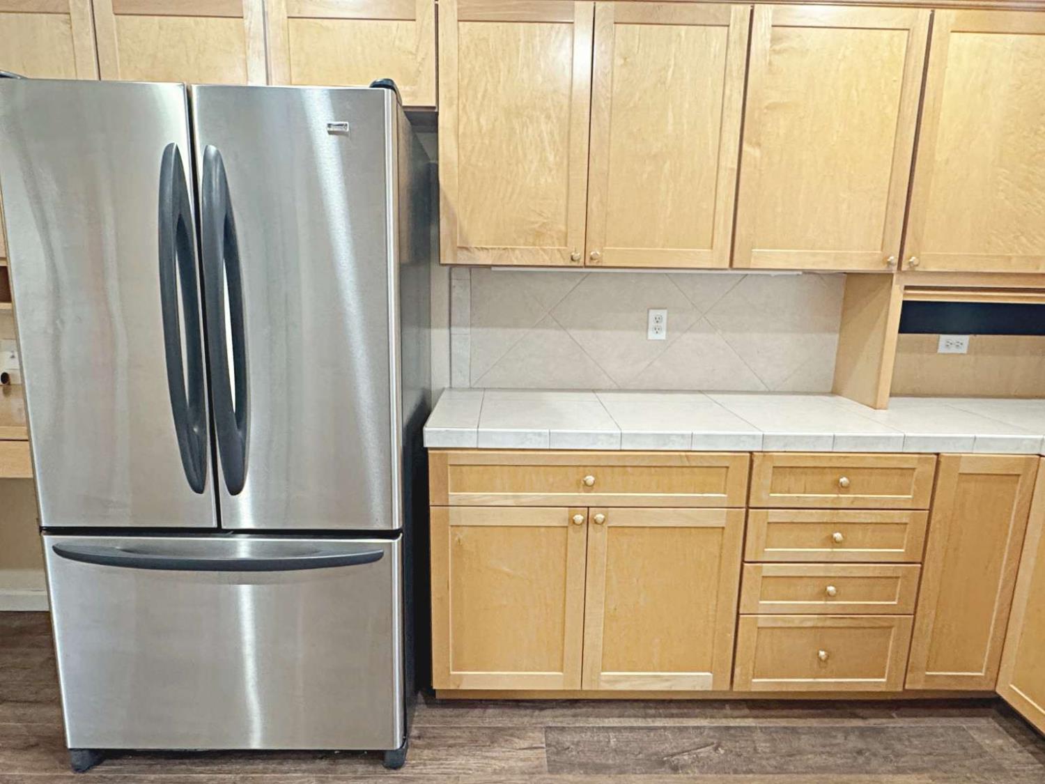 6249 Sunmist Way Citrus Heights, CA 95621 - Photo 10 of 24 a view of a refrigerator with cabinets