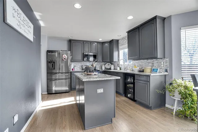 a bedroom with a large bed and a flat screen tv