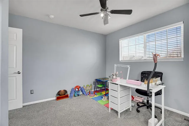 a view of a patio with table and chairs with wooden floor and fence