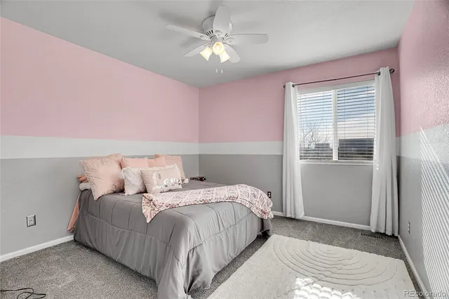 a view of a swimming pool with a house in the background