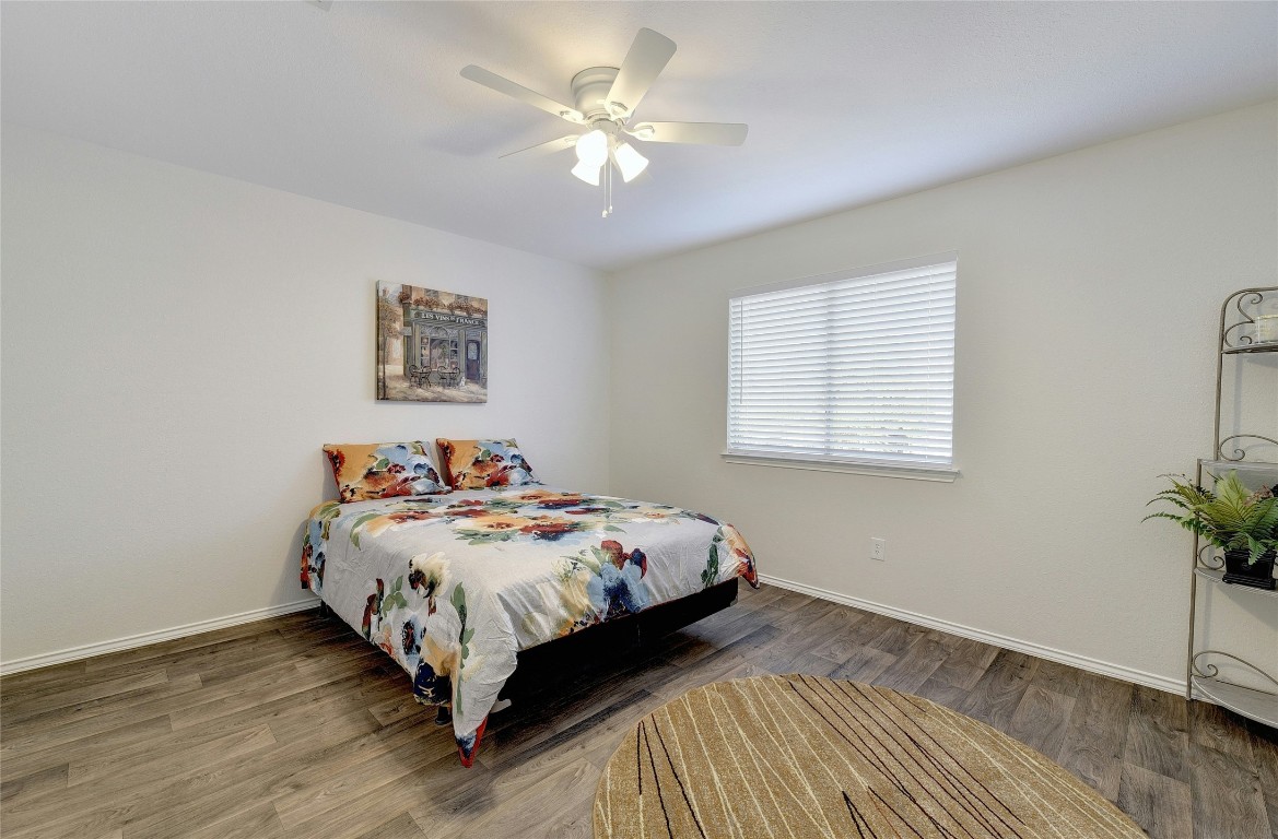 9716 Sugar Hill Drive, Unit A Austin, TX 78748 - Photo 18 of 40 a bedroom with a bed and a window