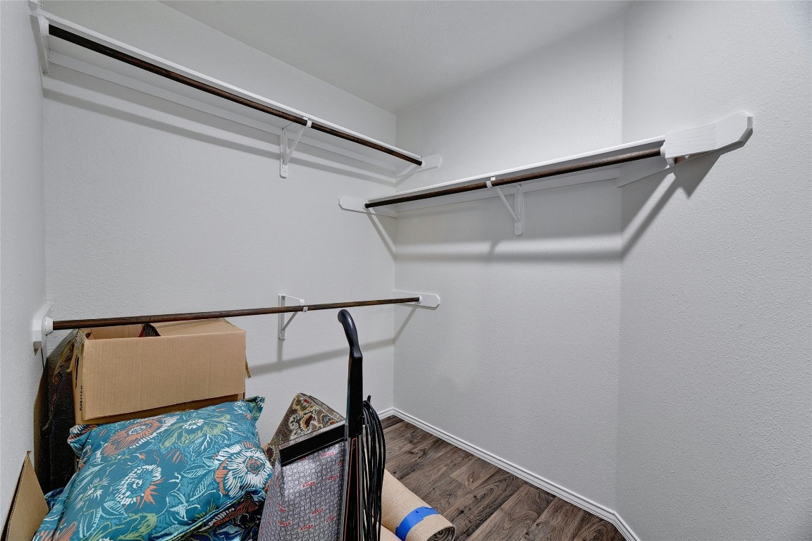 9716 Sugar Hill Drive, Unit A Austin, TX 78748 - Photo 23 of 40 Spacious closet featuring dark wood finished floors