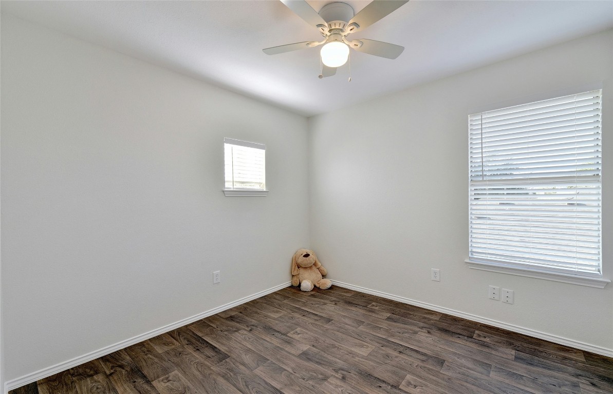 9716 Sugar Hill Drive, Unit A Austin, TX 78748 - Photo 24 of 40 a view of empty room with wooden floor and fan