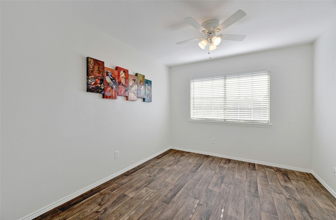 9716 Sugar Hill Drive, Unit A Austin, TX 78748 - Photo 28 of 40 an empty room with a window and a ceiling fan