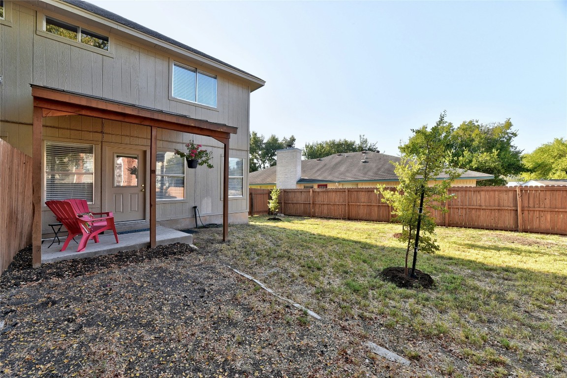 9716 Sugar Hill Drive, Unit A Austin, TX 78748 - Photo 34 of 40 a view of a house with backyard and trees
