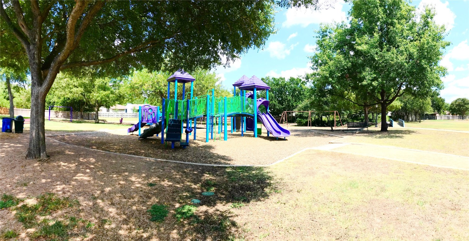 9716 Sugar Hill Drive, Unit A Austin, TX 78748 - Photo 39 of 40 a view of a park with swings and slides