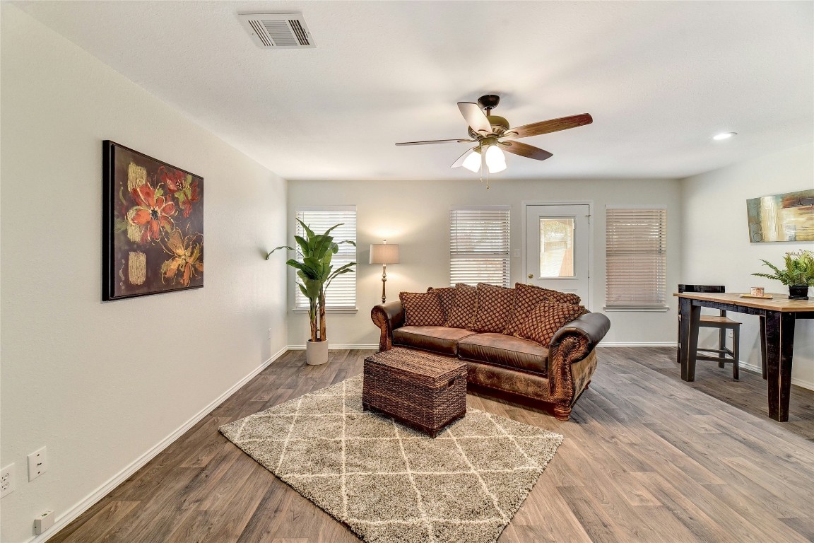 9716 Sugar Hill Drive, Unit A Austin, TX 78748 - Photo 5 of 40 a living room with furniture a table and a potted plant