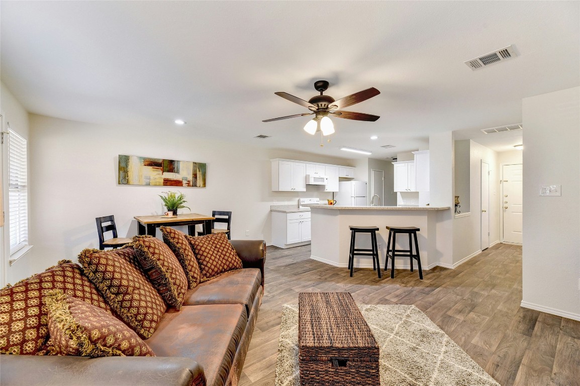 9716 Sugar Hill Drive, Unit A Austin, TX 78748 - Photo 7 of 40 a living room with furniture and kitchen view