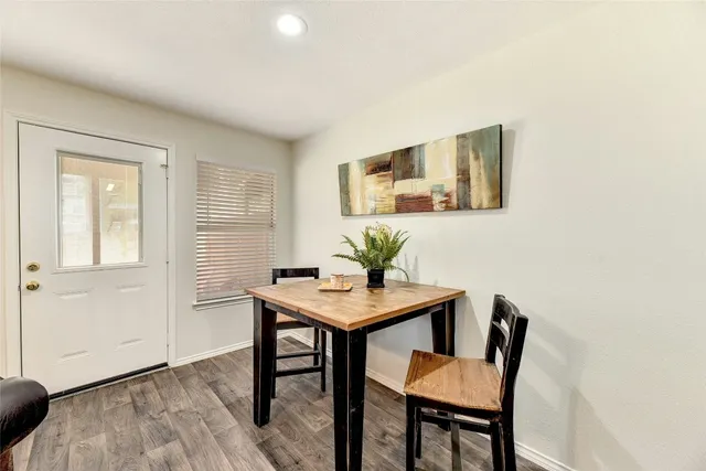 a view of a livingroom with furniture and wooden floor