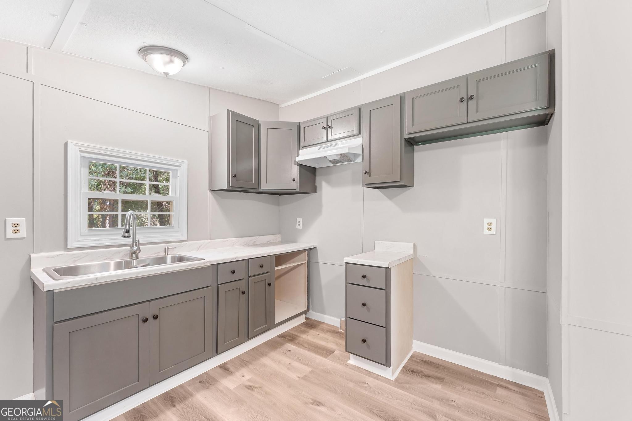 1528 Hodges Mill Road Hartwell, GA 30643 - Photo 11 of 37 a kitchen with a sink stove and refrigerator