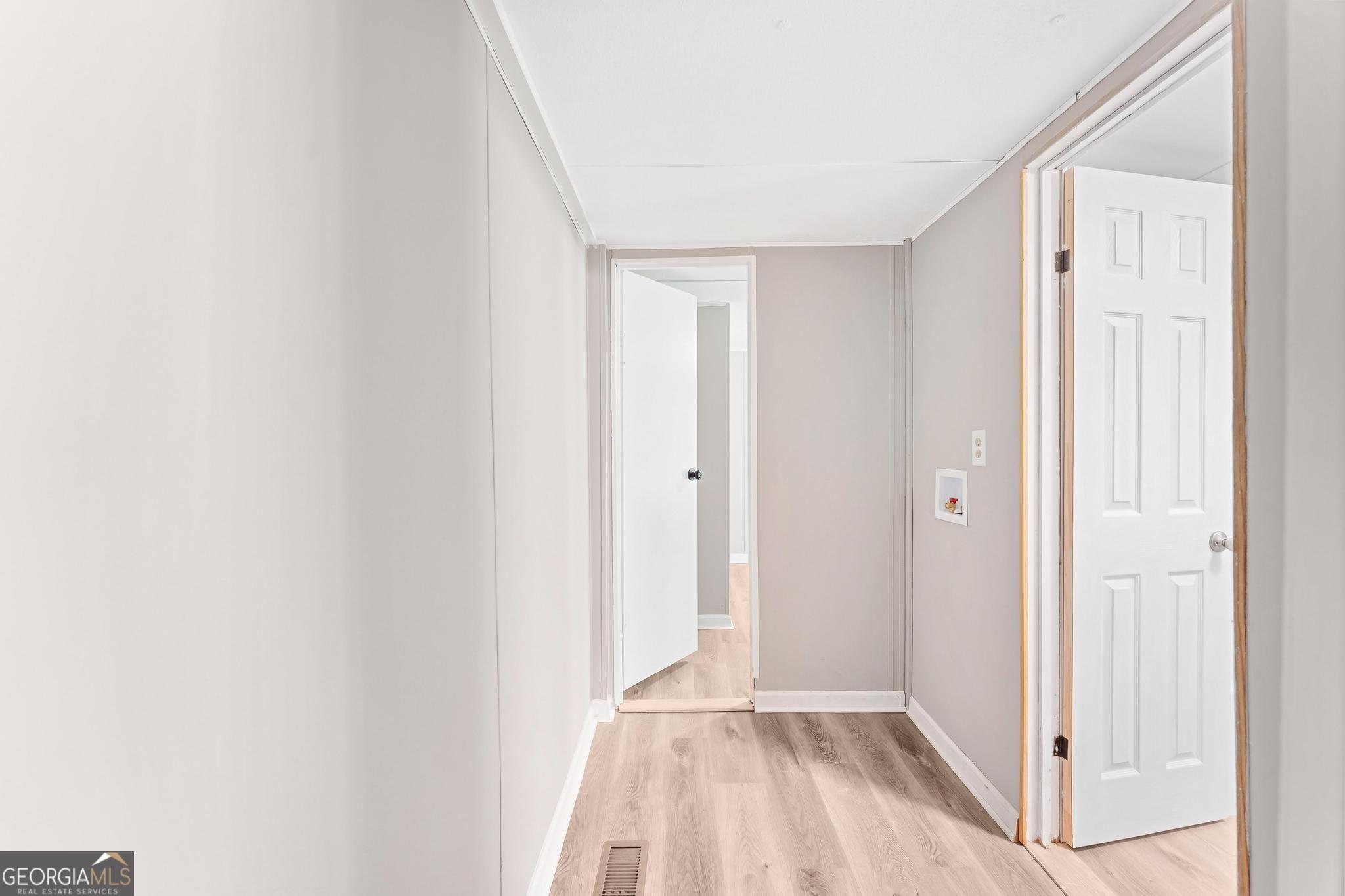 1528 Hodges Mill Road Hartwell, GA 30643 - Photo 15 of 37 a view of hallway with closet and chandelier