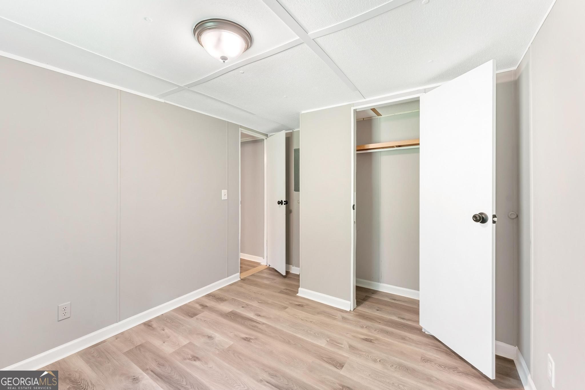 1528 Hodges Mill Road Hartwell, GA 30643 - Photo 20 of 37 a view of empty room with wooden floor and fan