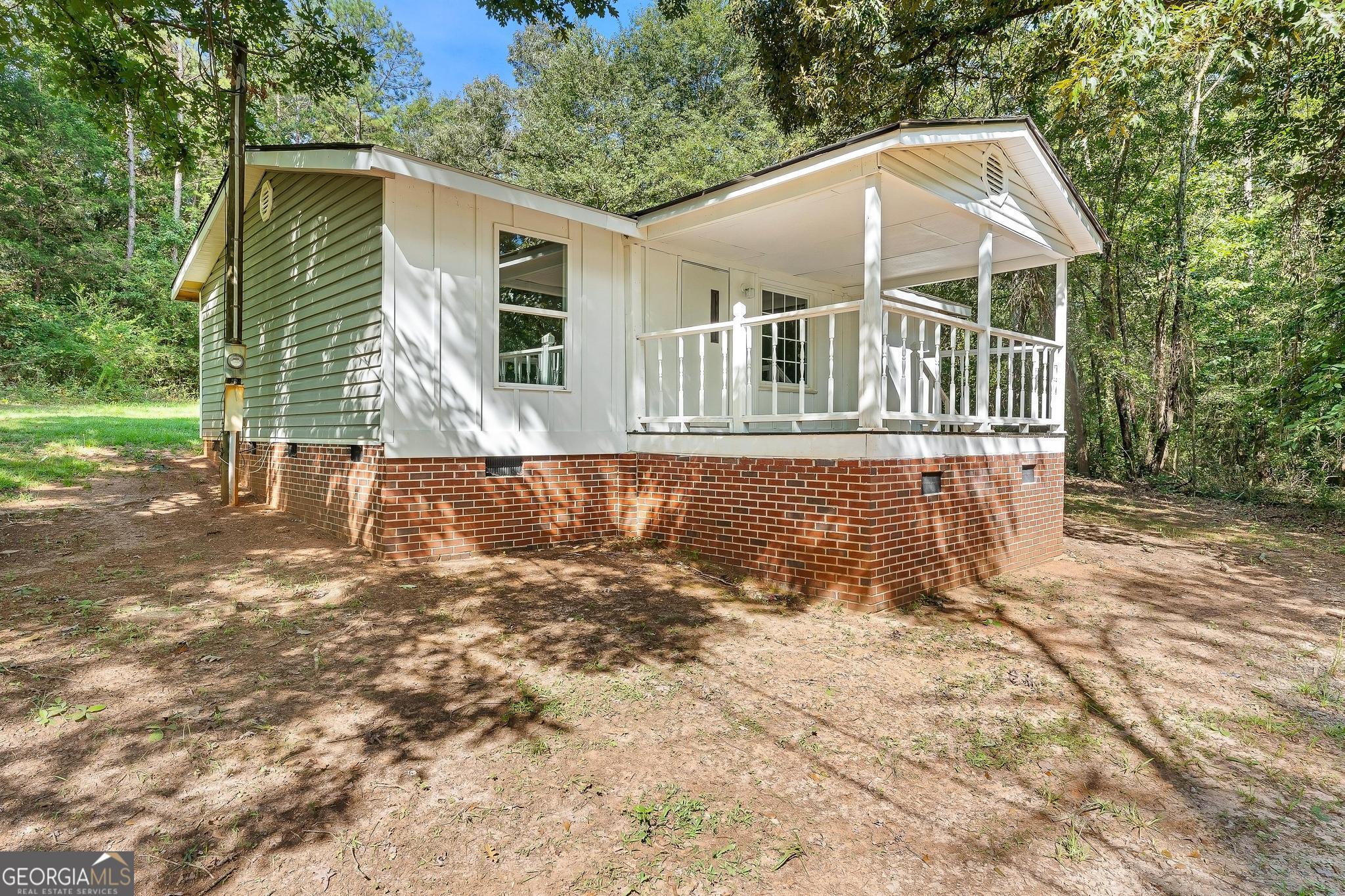 1528 Hodges Mill Road Hartwell, GA 30643 - Photo 2 of 37 a view of a house with a yard