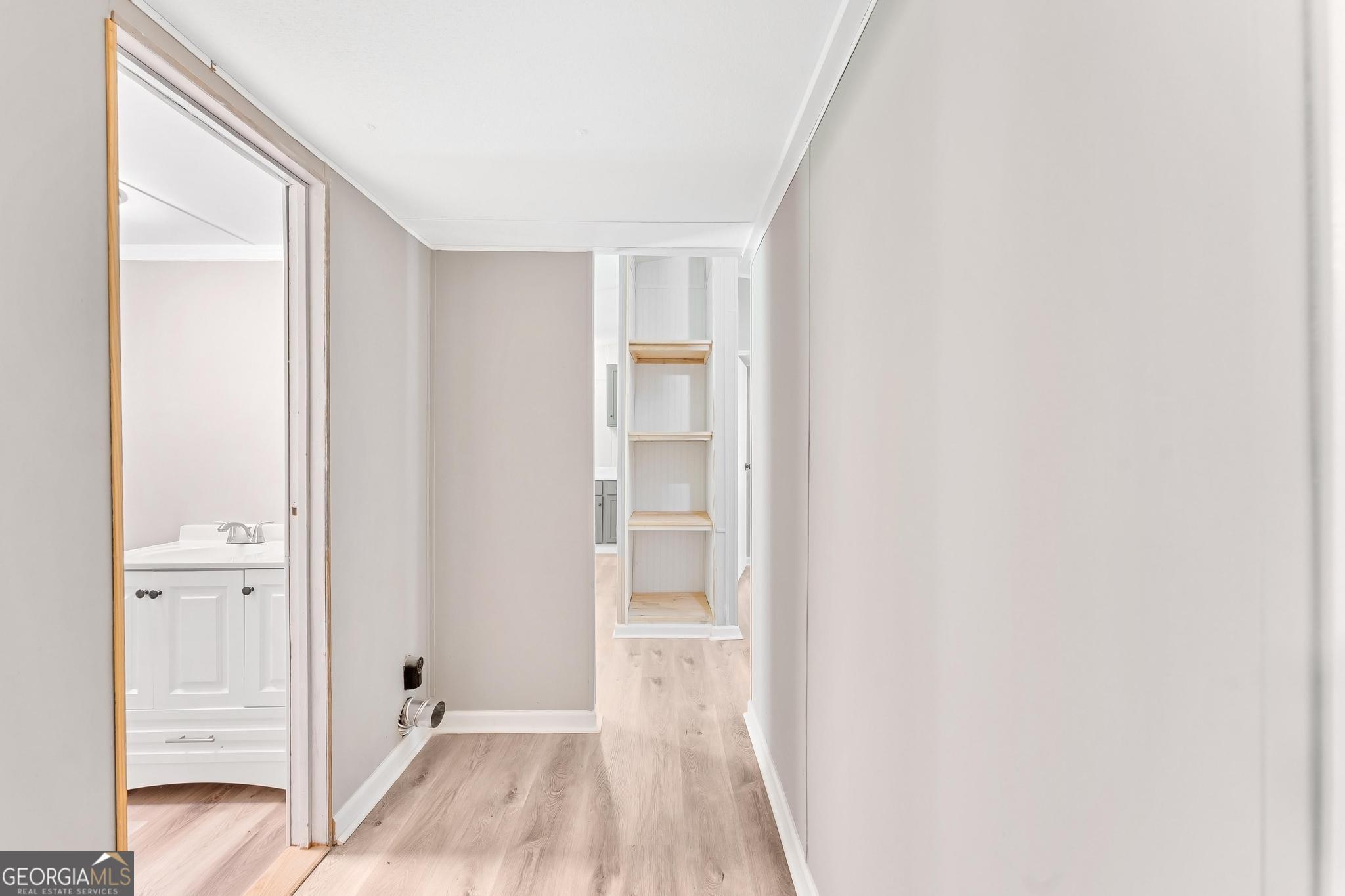 1528 Hodges Mill Road Hartwell, GA 30643 - Photo 21 of 37 a view of a hallway with wooden floor and closet