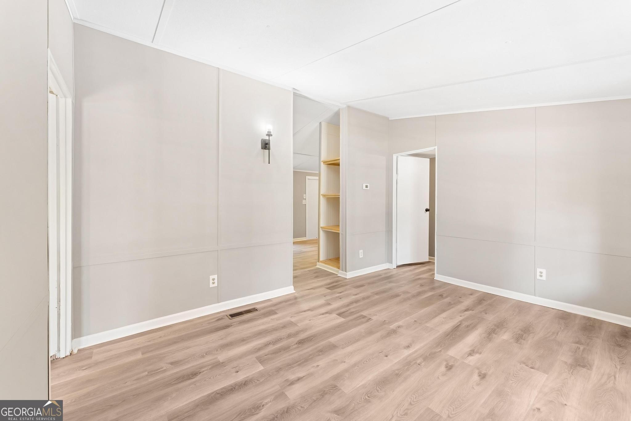 1528 Hodges Mill Road Hartwell, GA 30643 - Photo 6 of 37 a view of an empty room with wooden floor