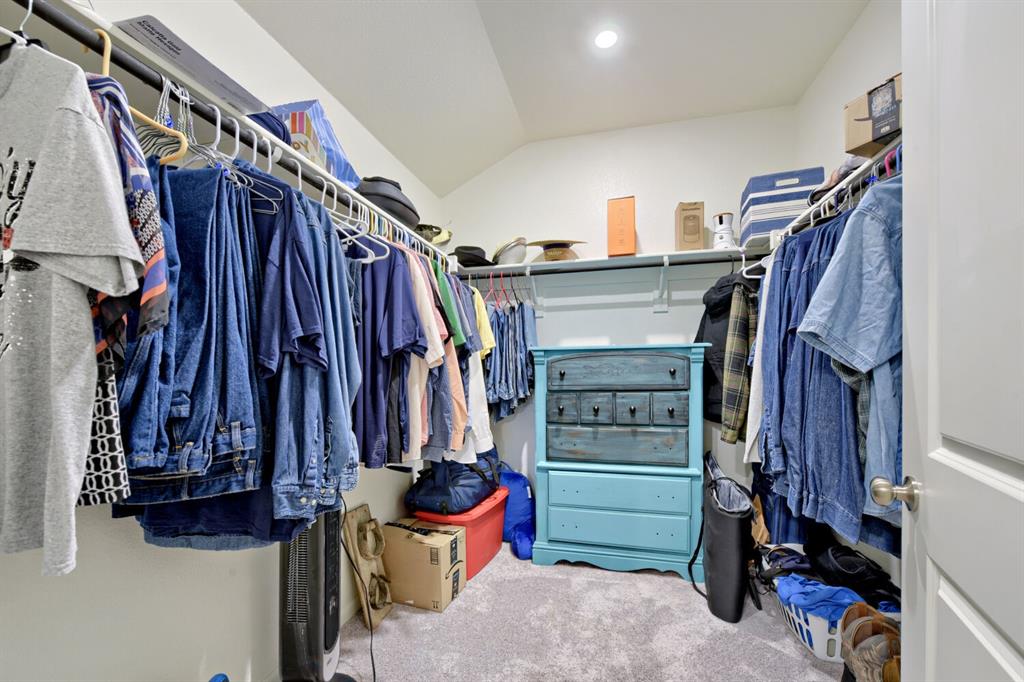 420 Jameson Springtown, TX 76082 - Photo 14 of 29 a view of walk in closet with clothes