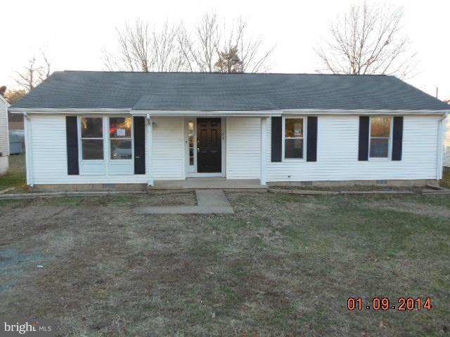 155 Lea Road Colonial Beach, VA 22443 - Photo 1 of 13 a front view of a house with a garden