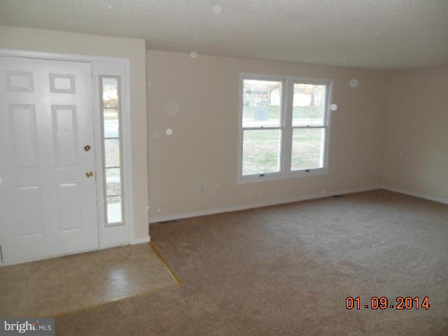 155 Lea Road Colonial Beach, VA 22443 - Photo 3 of 13 an empty room with windows
