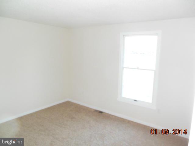 155 Lea Road Colonial Beach, VA 22443 - Photo 8 of 13 an empty room with a window