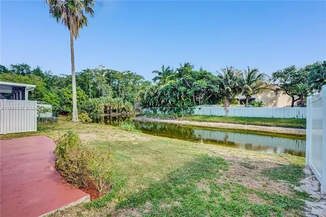 a view of a garden with a house
