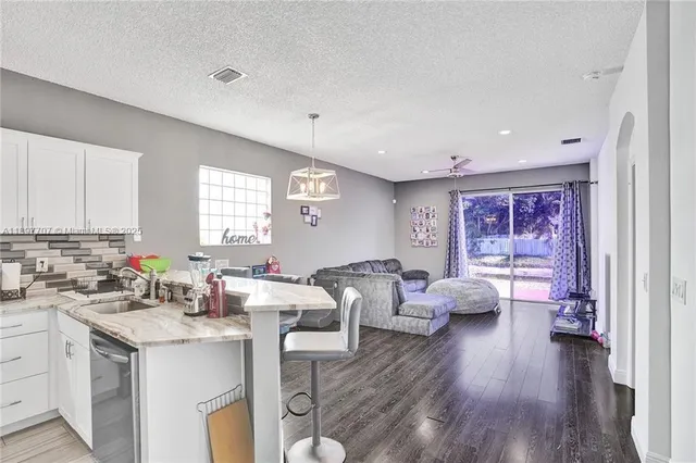 a room with furniture and wooden floor