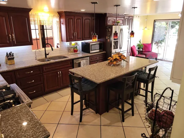 a kitchen with a sink and cabinets