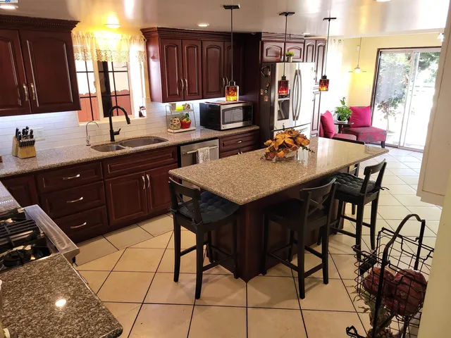 a kitchen with a sink and cabinets