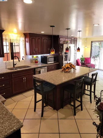 a kitchen with a dining table and chairs