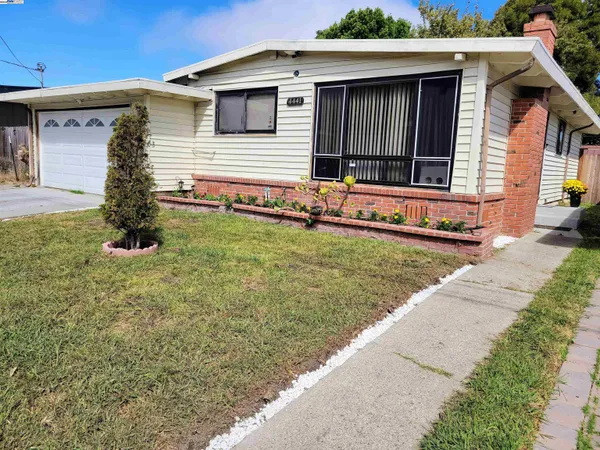 a front view of a house with garage