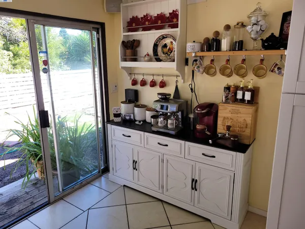 a kitchen with stainless steel appliances cabinets and window