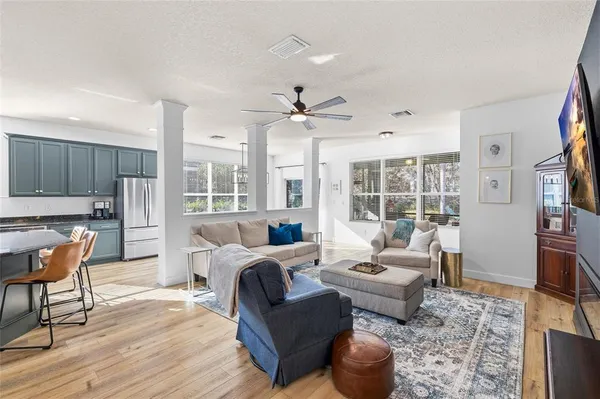 a living room with fireplace furniture and a flat screen tv