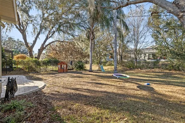 an aerial view of a house with outdoor space and lake view