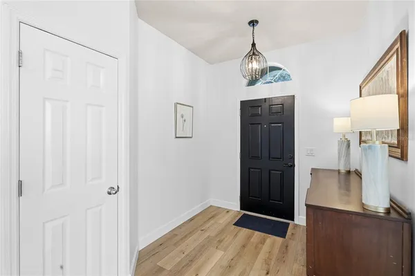 a spacious bedroom with a bed and a dresser