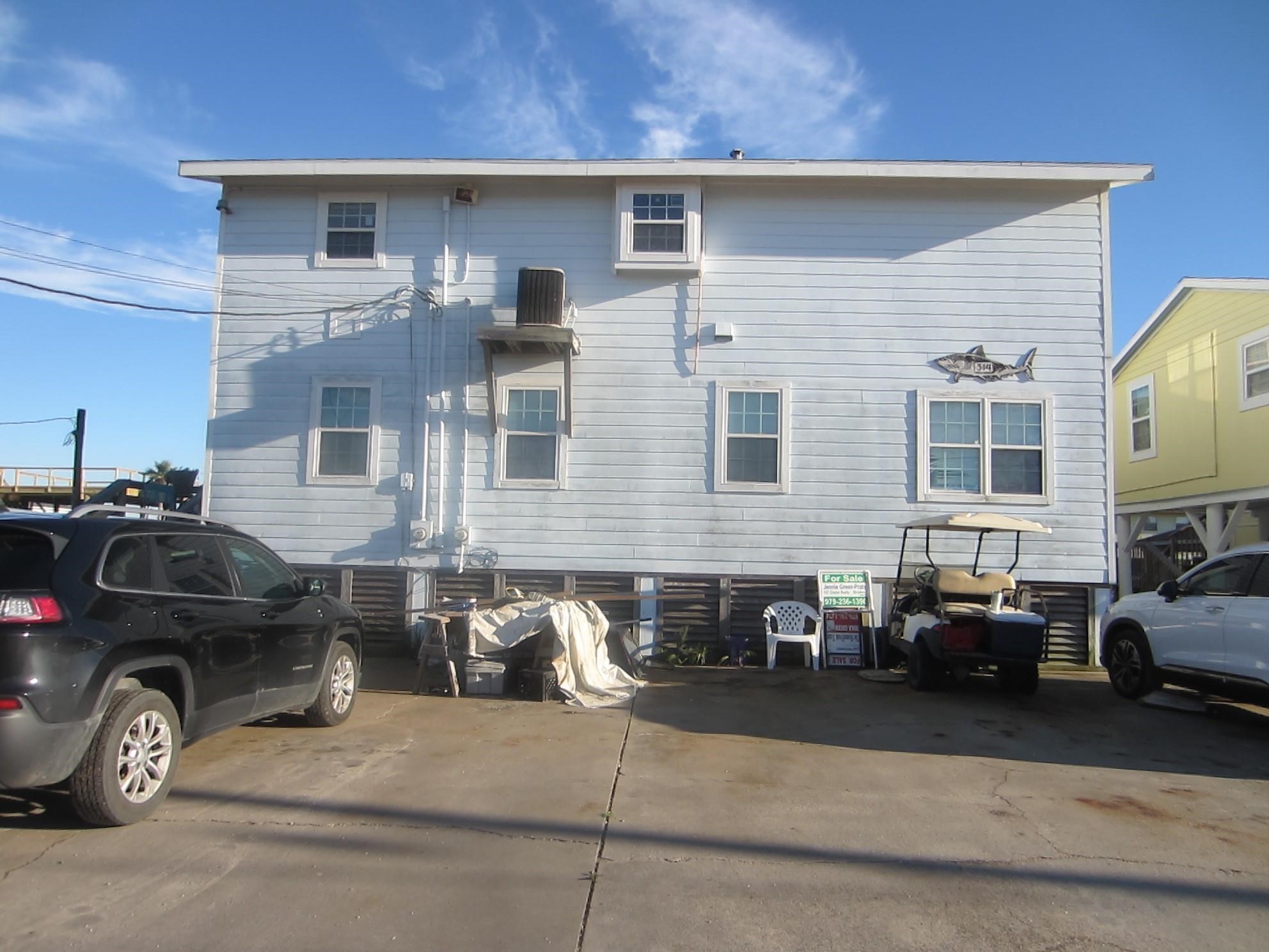 314 Shark Lane Surfside Beach, TX 77541 - Photo 11 of 12 a car parked in front of a house